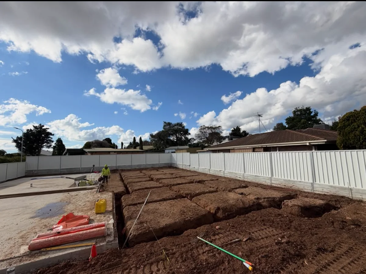 Grid of strip footing trenches dug for a new residential slab in an Adelaide backyard